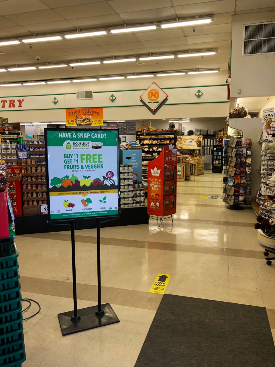 Signage for Snap Card in grocery store to get free fruits and vegetables.