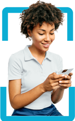 A young woman holds and views a mobile device.