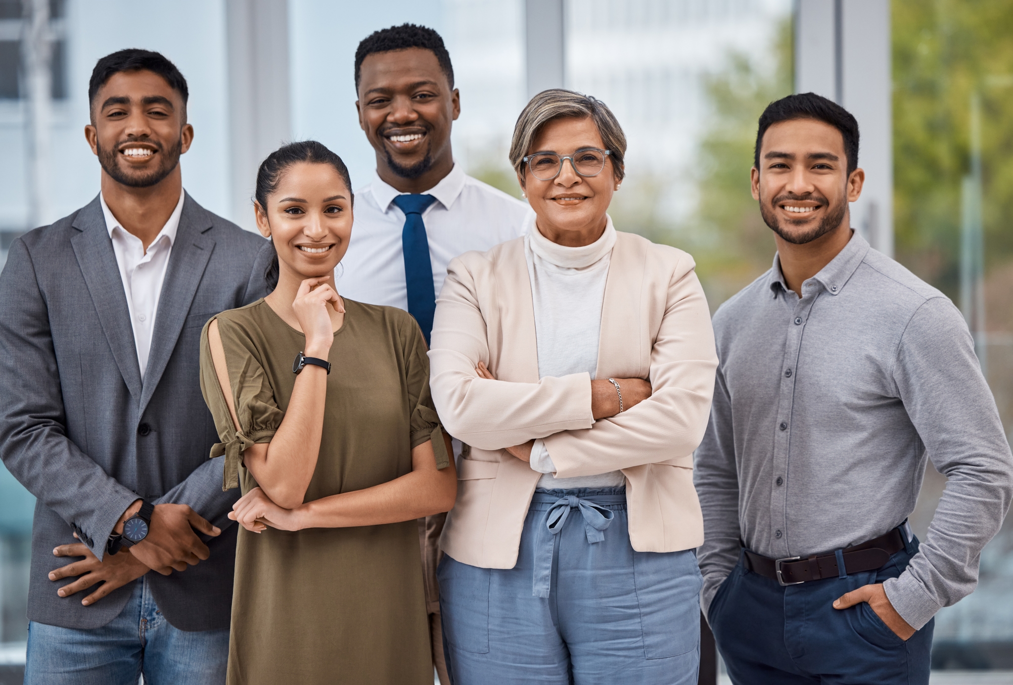Portrait of a group of businesspeople working together in an office.